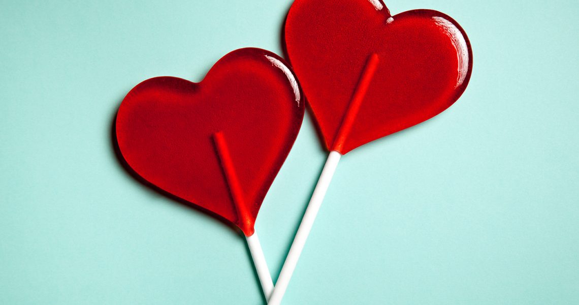Two lollipops. Red hearts. Candy. Love concept. Valentine day.